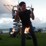 Fire poi swinging on Bondi Beach at a Chanukah party