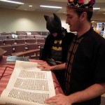 Jews reading the meggilat Esther in the Synagogue