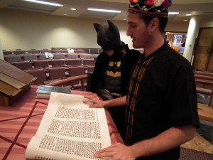 Jews reading the meggilat Esther in the Synagogue