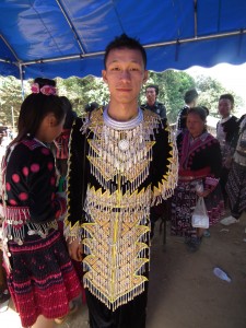 A young Hmong man with an eye-catching outfit.